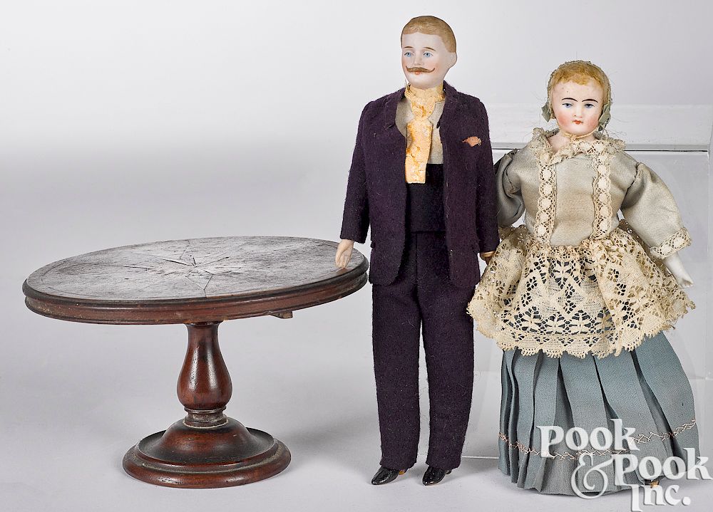 Appraisal: Bisque dollhouse dolls Bisque dollhouse dolls with painted facial features