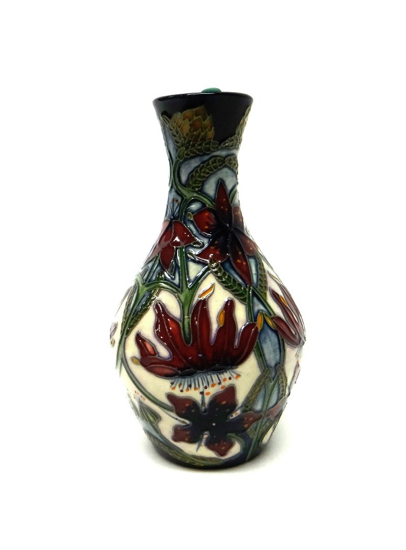 Appraisal: A small Moorcroft 'Passion Flower' vase cm high boxed