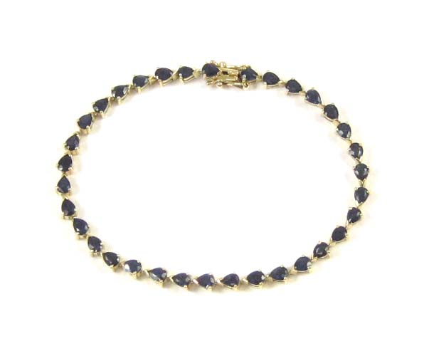 Appraisal: SAPPHIRE AND FOURTEEN KARAT GOLD BRACELET inches in length and