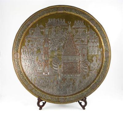 Appraisal: A large Cairoware charger depicting a procession with two camels