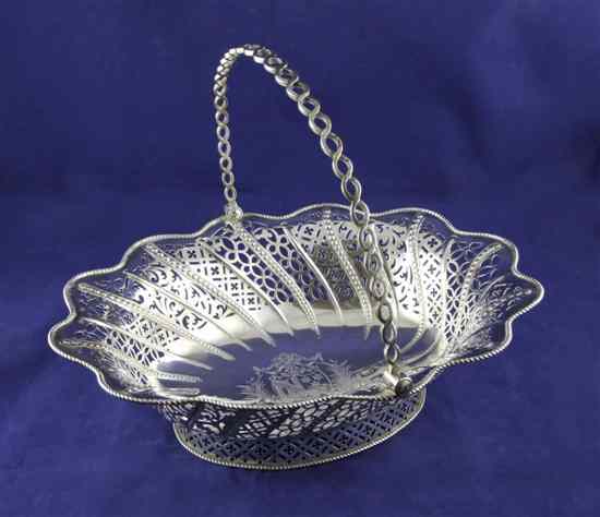 Appraisal: A George III silver oval cake basket with pierced foliate