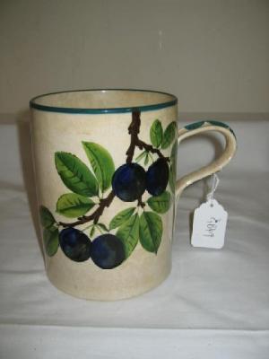 Appraisal: A WEMYSS TANKARD of cylindrical form painted with plums on