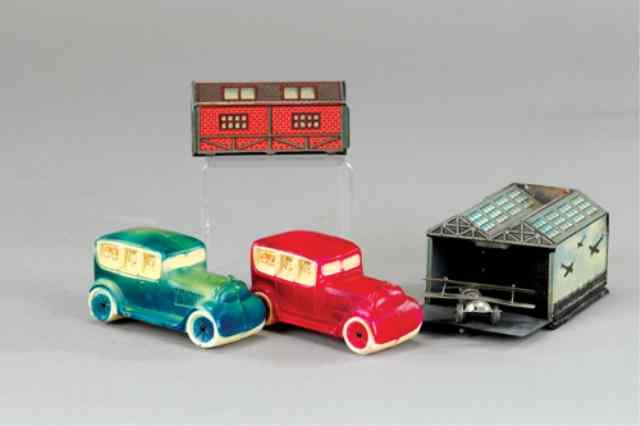 Appraisal: GROUPING OF TIN PENNY TOY BUILDING AND CELLULOID A Includes