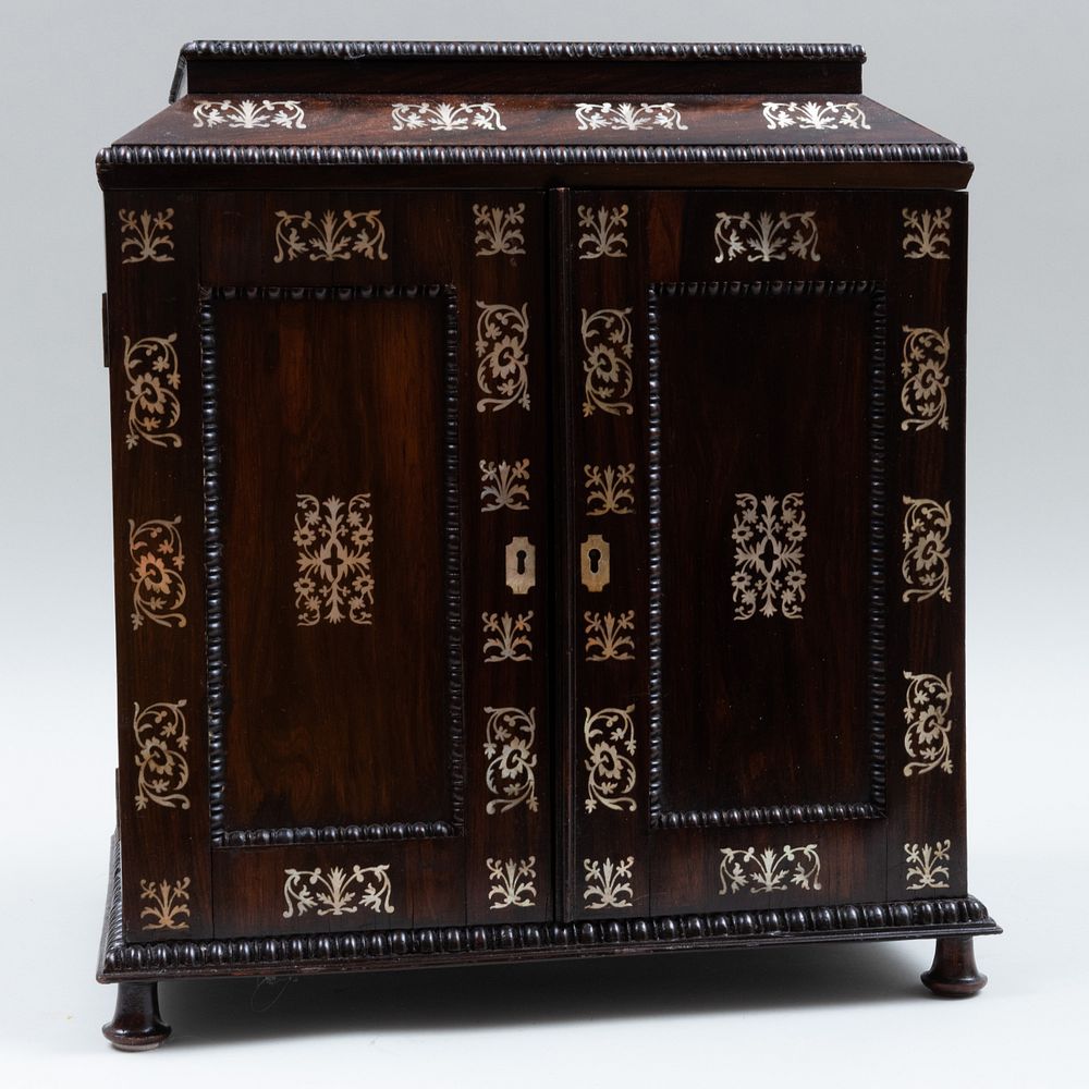 Appraisal: Victorian Mother-of-Pearl and Rosewood Coin Cabinet The side with brass