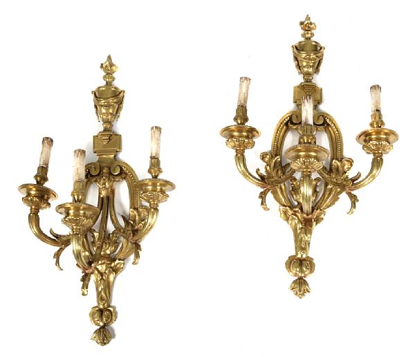 Appraisal: A pair of Louis XVI style gilt bronze three light