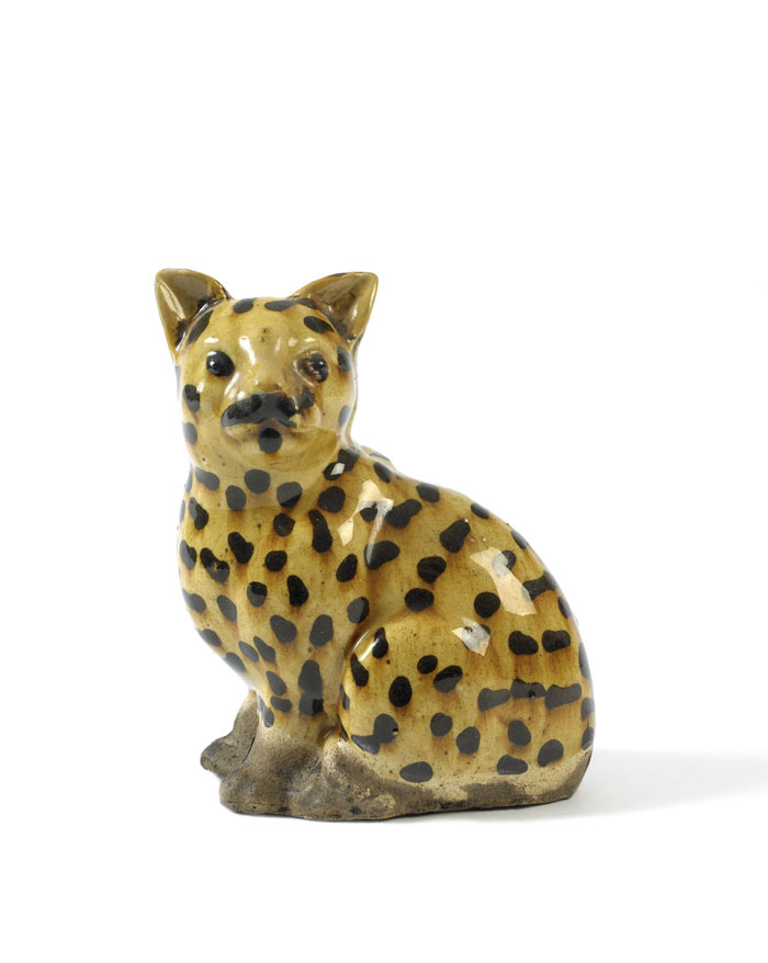 Appraisal: GLAZED YELLOWWARE SEATED SPOTTED CAT PROBABLY ENGLISH EARLY NINETEENTH CENTURY