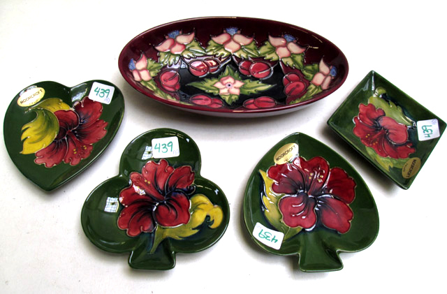 Appraisal: MOORCROFT POTTERY OVAL BOWL AND FOUR SMALL DISHES hand painted