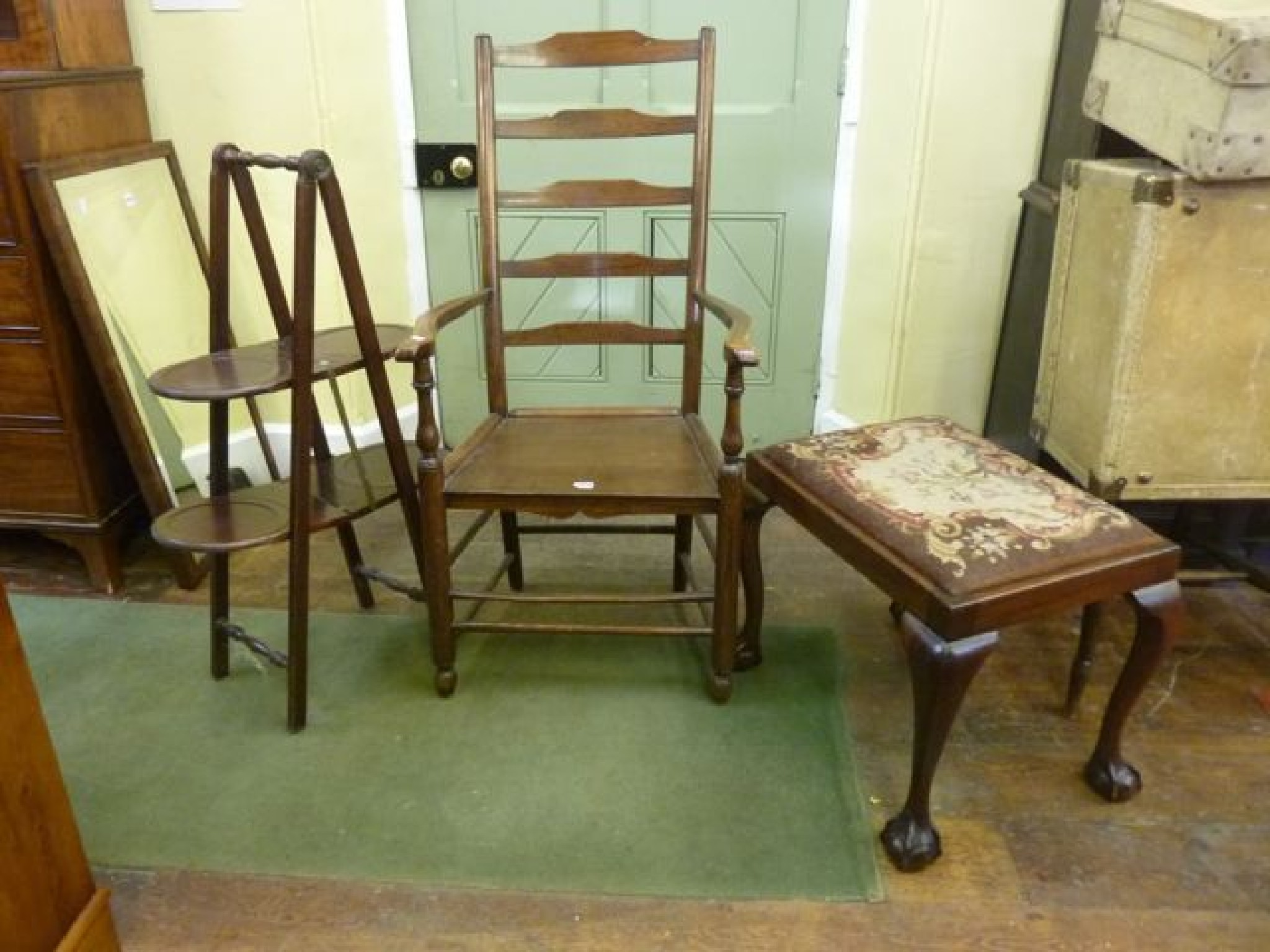 Appraisal: A simple Georgian ashwood ladder back elbow chair on turned