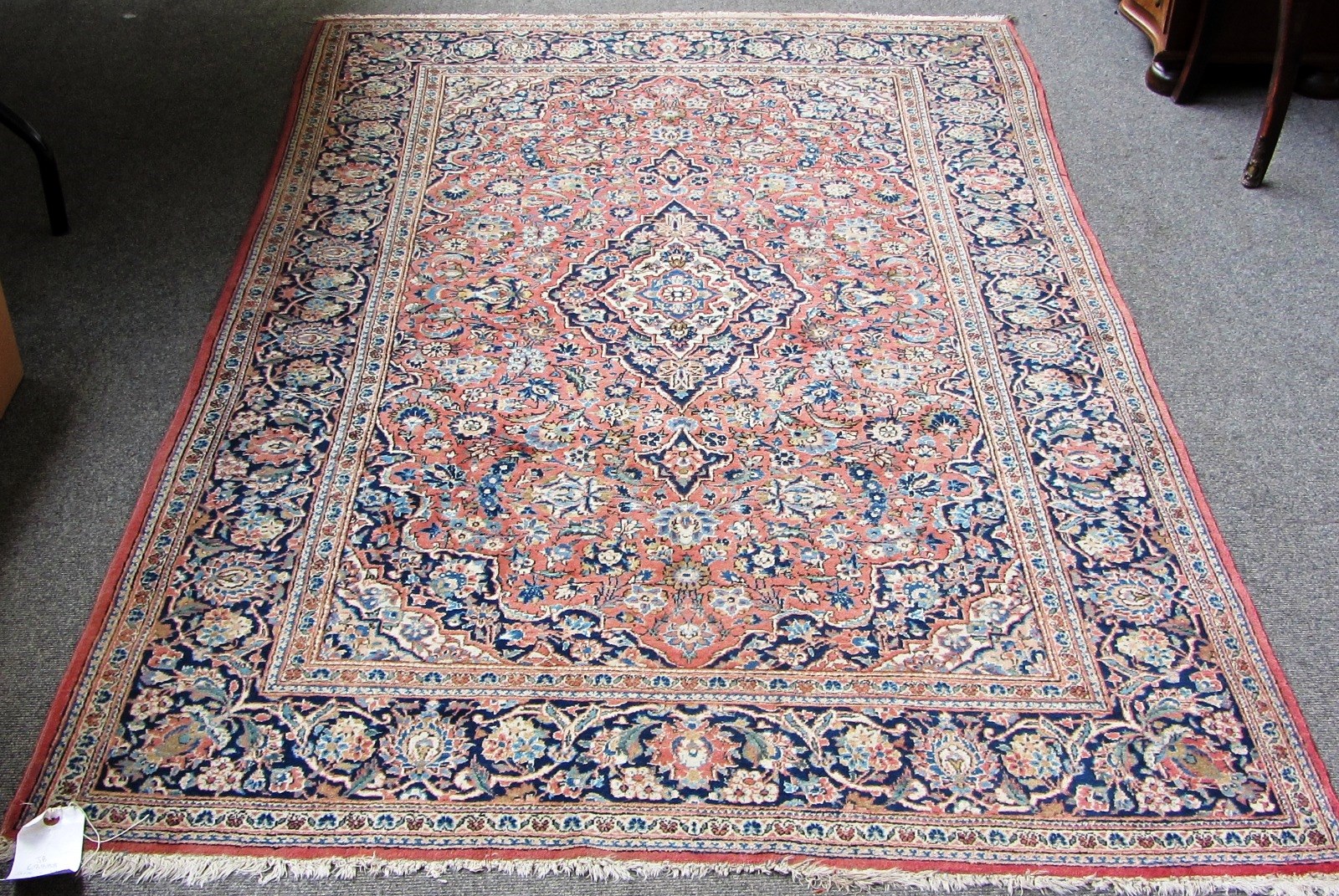 Appraisal: A Kashan rug Perisan the madder field with a dark