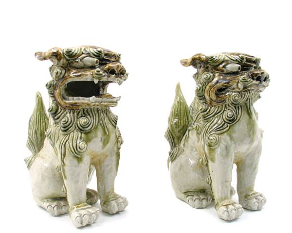 Appraisal: A pair of celadon glazed ceramic fu lions height in