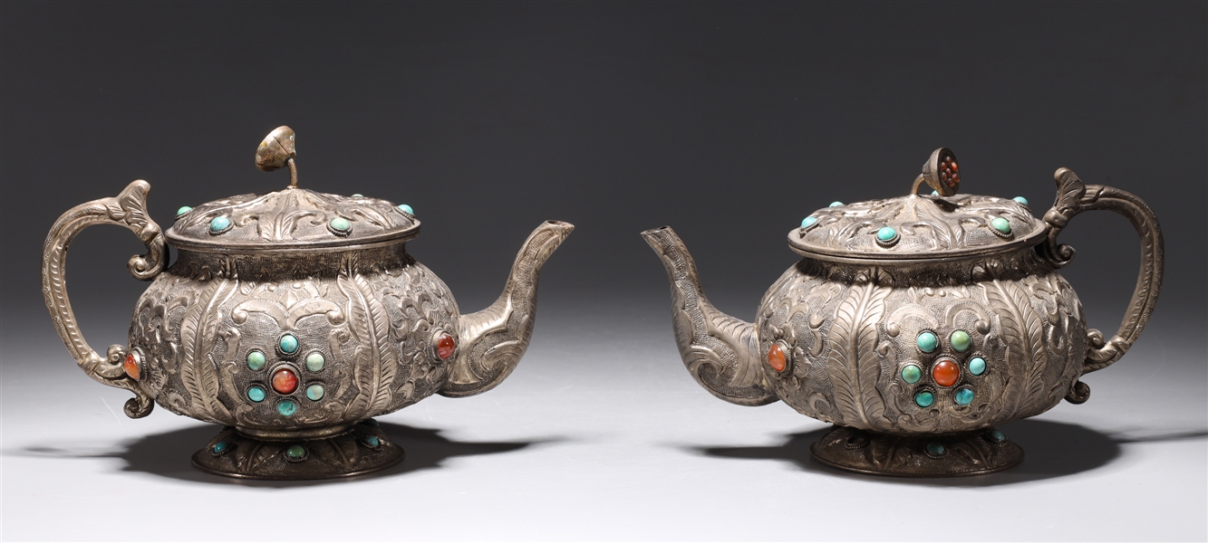 Appraisal: Pair of Chinese repose metal teapots with turquoise and glass