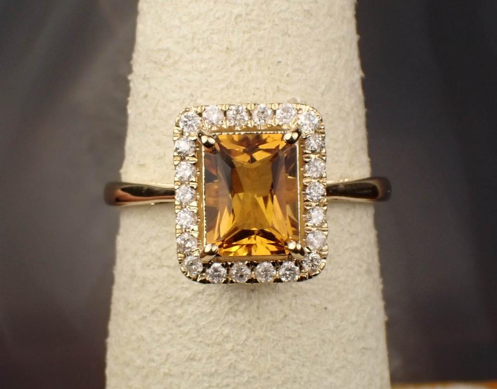 Appraisal: CITRINE DIAMOND AND FOURTEEN KARAT GOLD RING The yellow gold