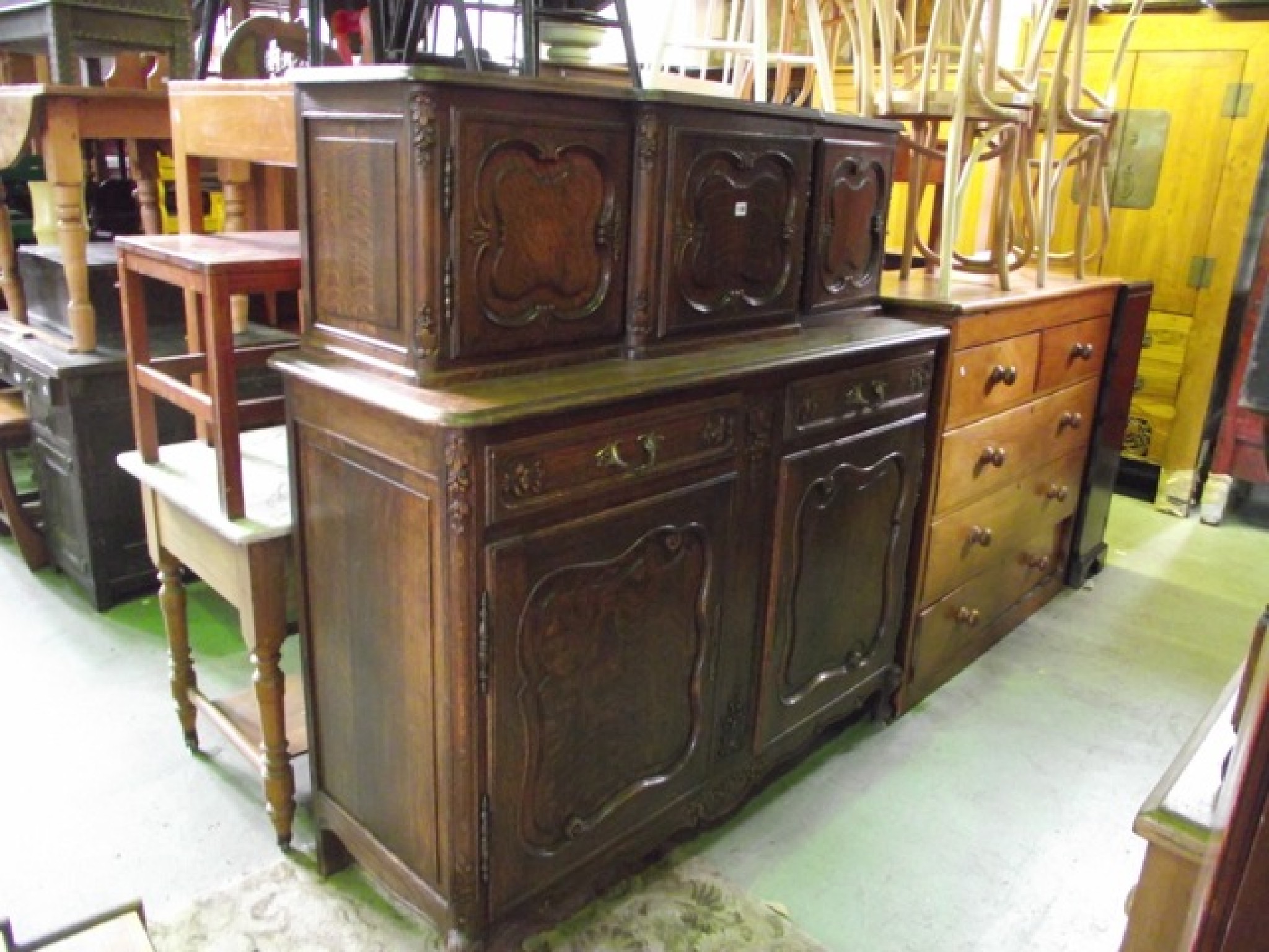 Appraisal: A continental medium oak two sectional buffet the upper section