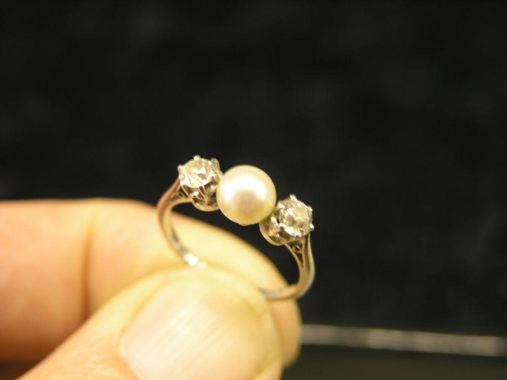 Appraisal: A two stone diamond ring set with central pearl ring