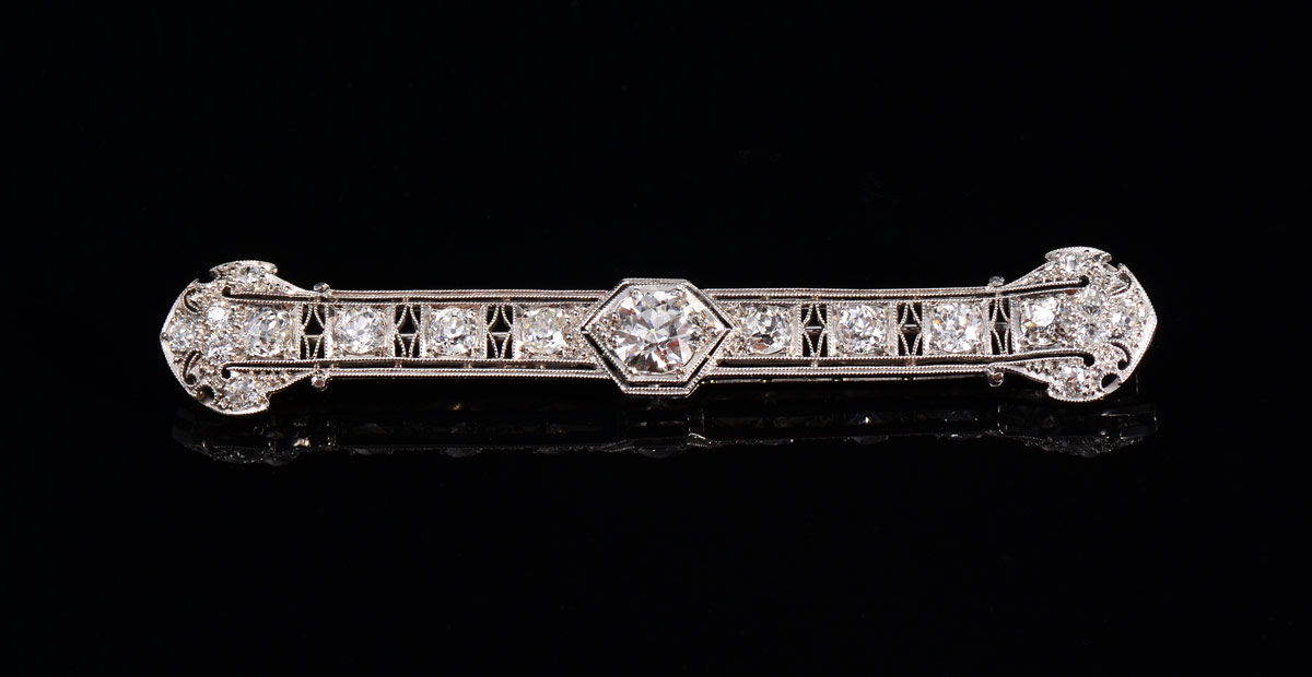 Appraisal: A FINE PLATINUM FILIGREE DIAMOND BAR PIN Centering an approx