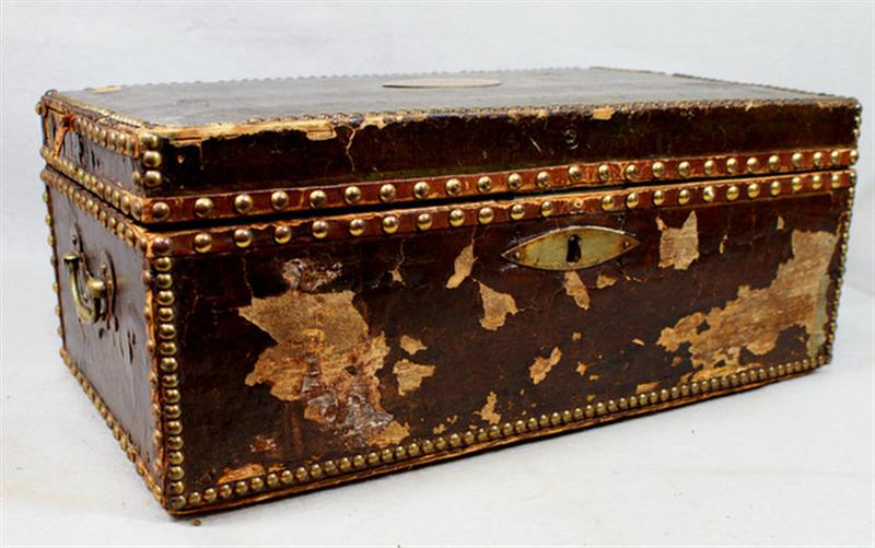 Appraisal: Leather covered valuables trunk th c brass studded edges wallpaper