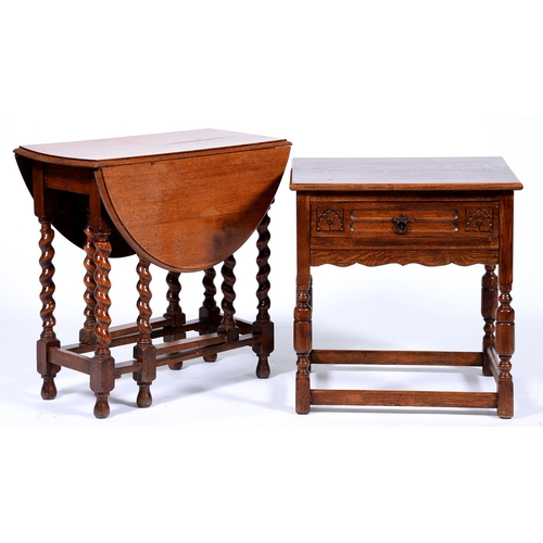 Appraisal: An oak side table the leaf carved drawer with iron