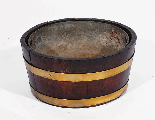 Appraisal: A VICTORIAN COOPERED OAK CIRCULAR WINE COOLER with zinc liner