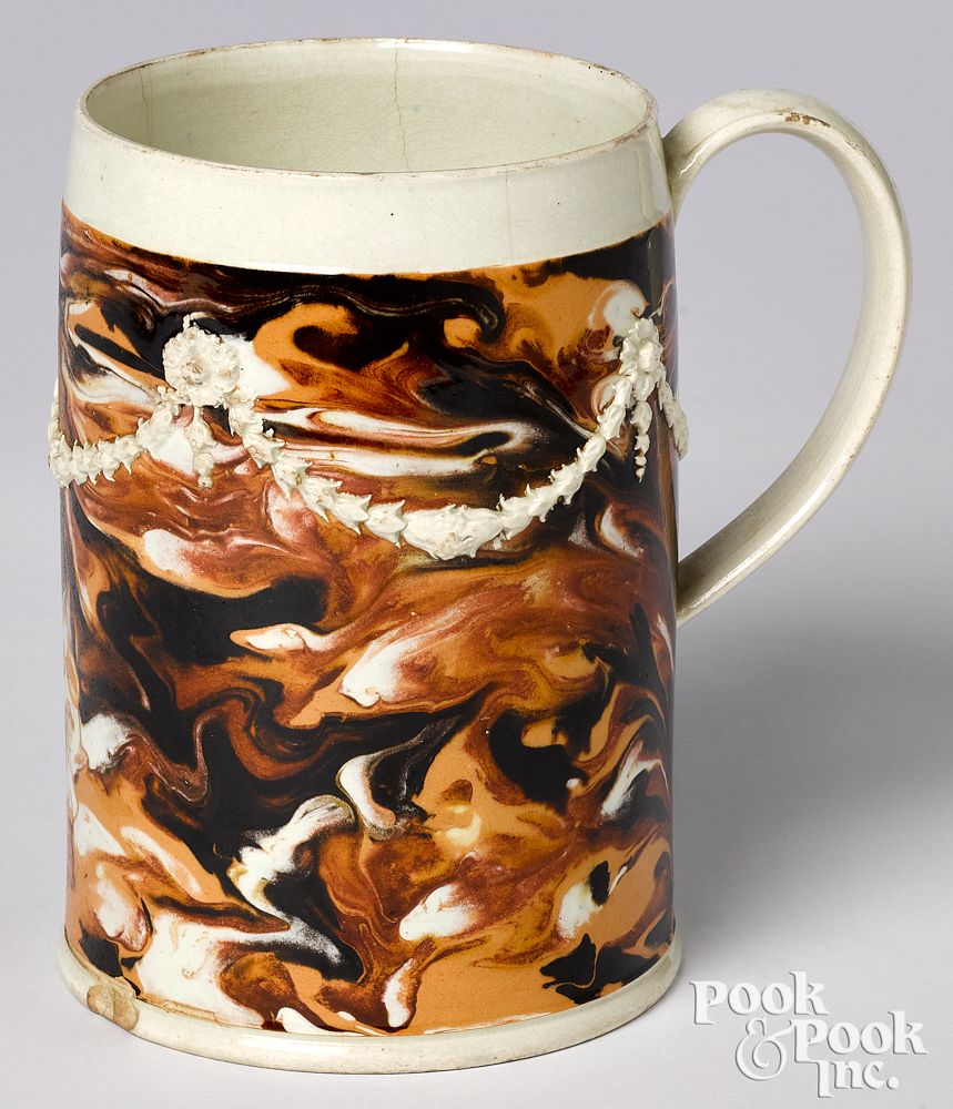 Appraisal: Mocha mug Mocha mug with marbleized glaze and applied bellflower