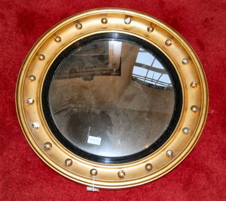 Appraisal: A Regency style convex wall mirror the moulded circular frame