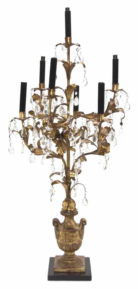 Appraisal: An Italian Giltwood and Tole Seven-Light Candelabrum in the form