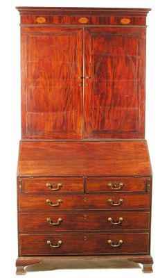 Appraisal: A mahogany bureau cabinet the moulded cavetto cornice to a