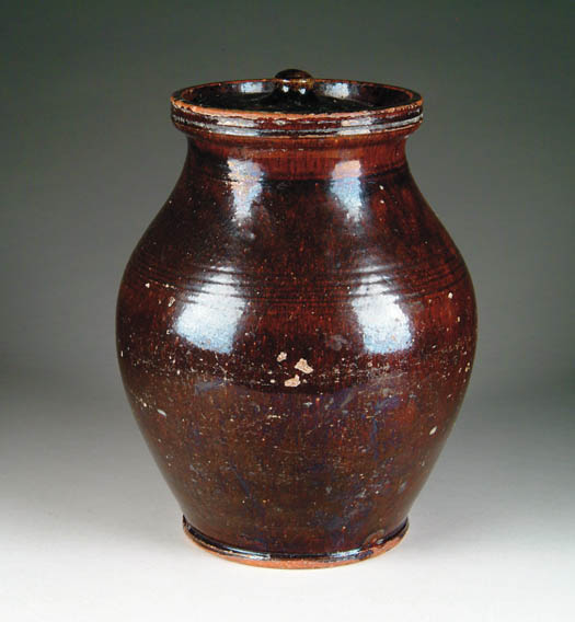 Appraisal: LARGE OVOID REDWARE COVERED JAR Incised lines at shoulder grooved