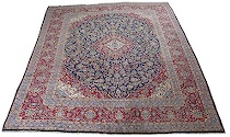 Appraisal: Kashan Area Carpet Navy blue background features a center medallion