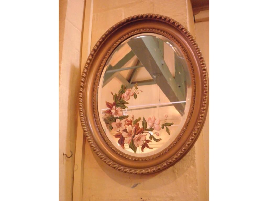 Appraisal: An early thC oval wall mirror the bevel plate painted