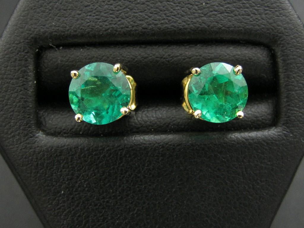 Appraisal: A Pair of Emerald Ear Studs each claw-set circular-cut stone