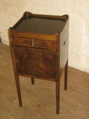 Appraisal: A GEORGE III MAHOGANY BEDSIDE CUPBOARD of canted square form