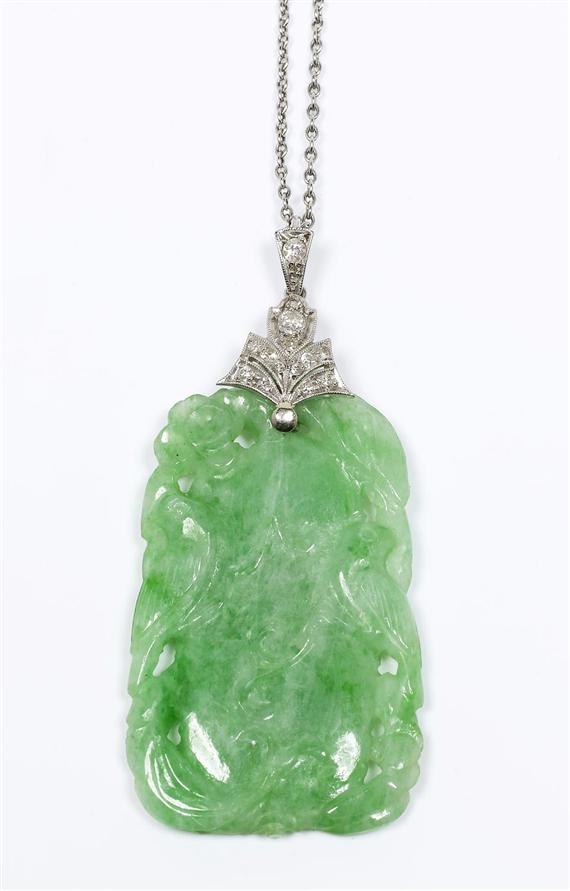 Appraisal: JADE AND DIAMOND PENDANT ca Platinum Fancy jade pendant of