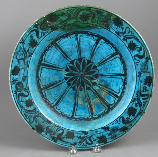 Appraisal: th th Century Persian blue glazed plate with black underglaze