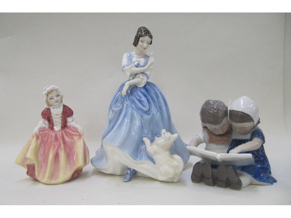 Appraisal: Royal Copenhagen figure of two children reading and two Royal