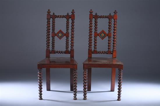 Appraisal: PAIR ENGLISH CARVED MAHOGANY MONOGRAMMED SIDECHAIRS Barley-twist stiles and crest-rail