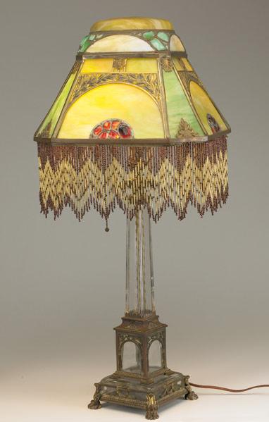 Appraisal: MOE BRIDGES LAMP Leaded-glass shade with eight panels domed top