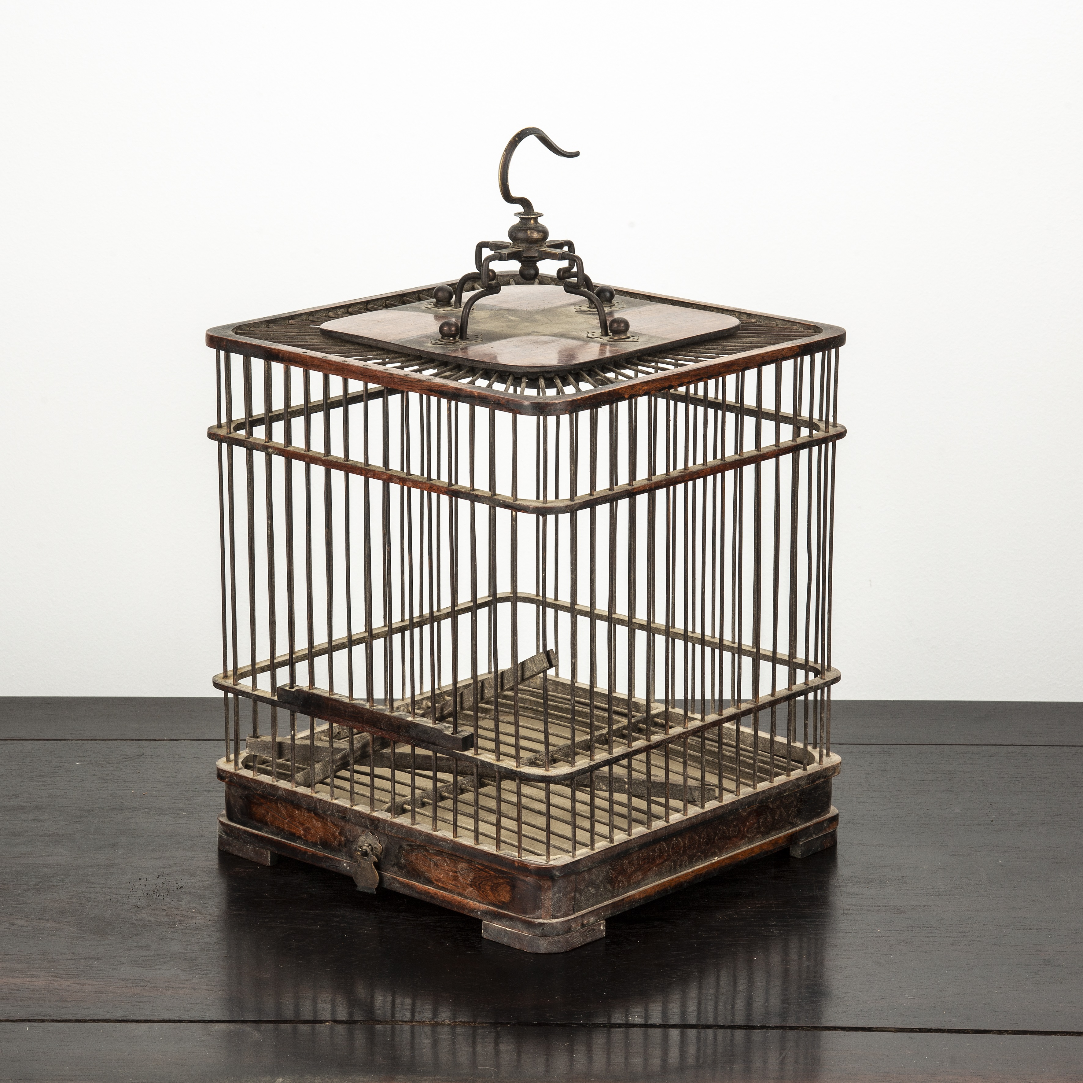 Appraisal: Carved wooden bird cage Chinese with applied hanging metal mount