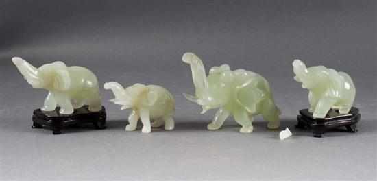 Appraisal: Four Chinese carved hardstone elephant figures each modeled as charging