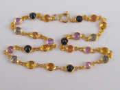 Appraisal: A yellow metal tests gold multi gem bracelet approx cm