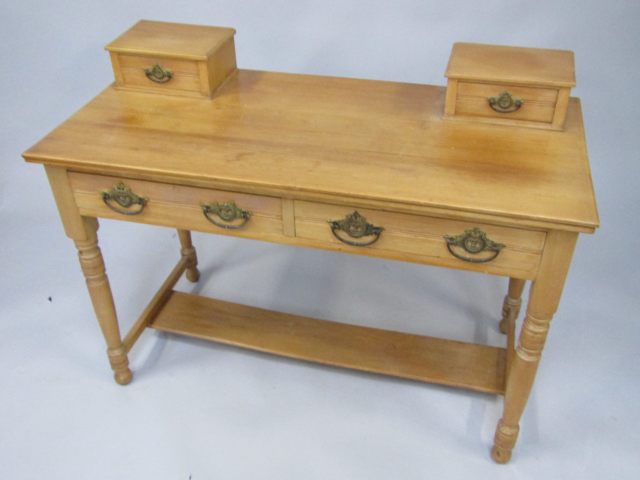 Appraisal: A Victorian pine dressing table the top with two trinket