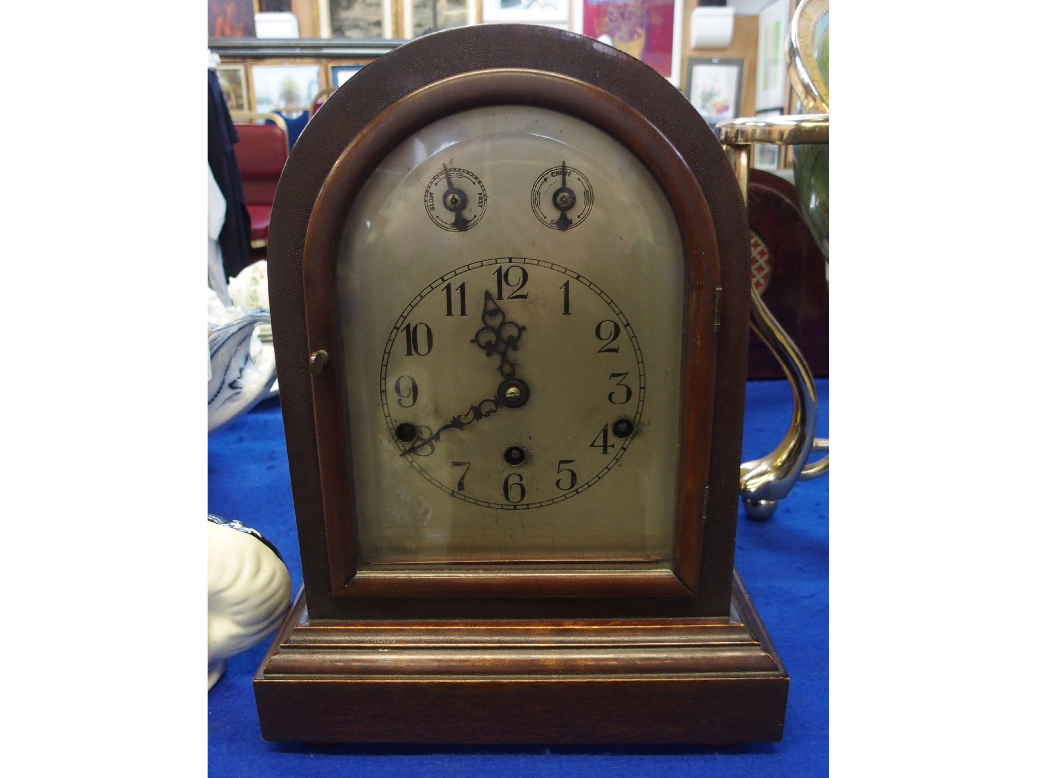 Appraisal: An Edwardian mahogany cased mantel clock with silvered dial