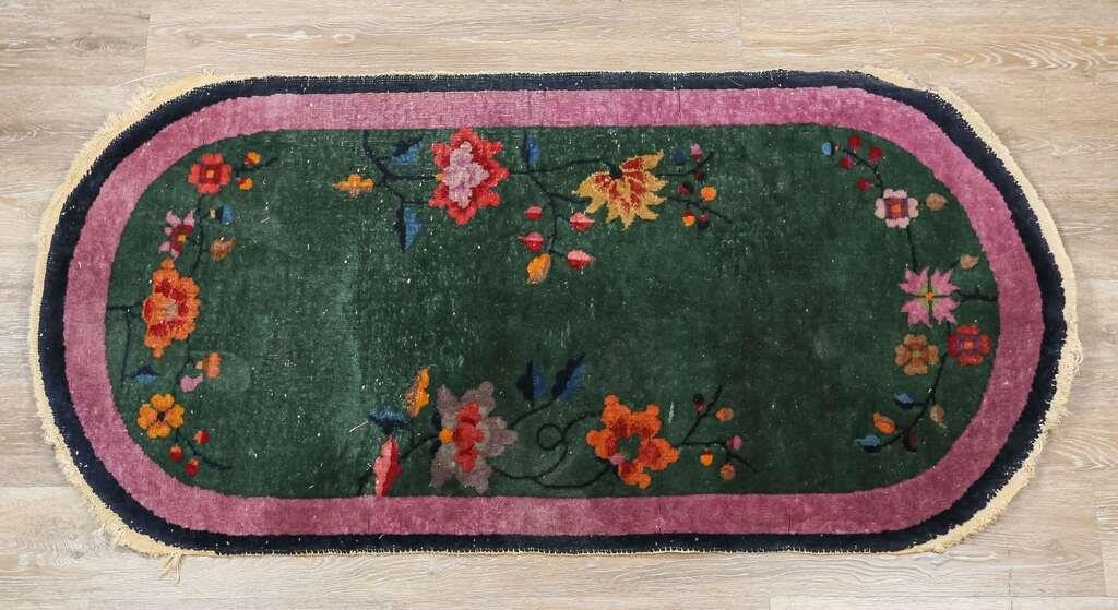 Appraisal: Art Deco Chinese rug Flowers on green field purple and