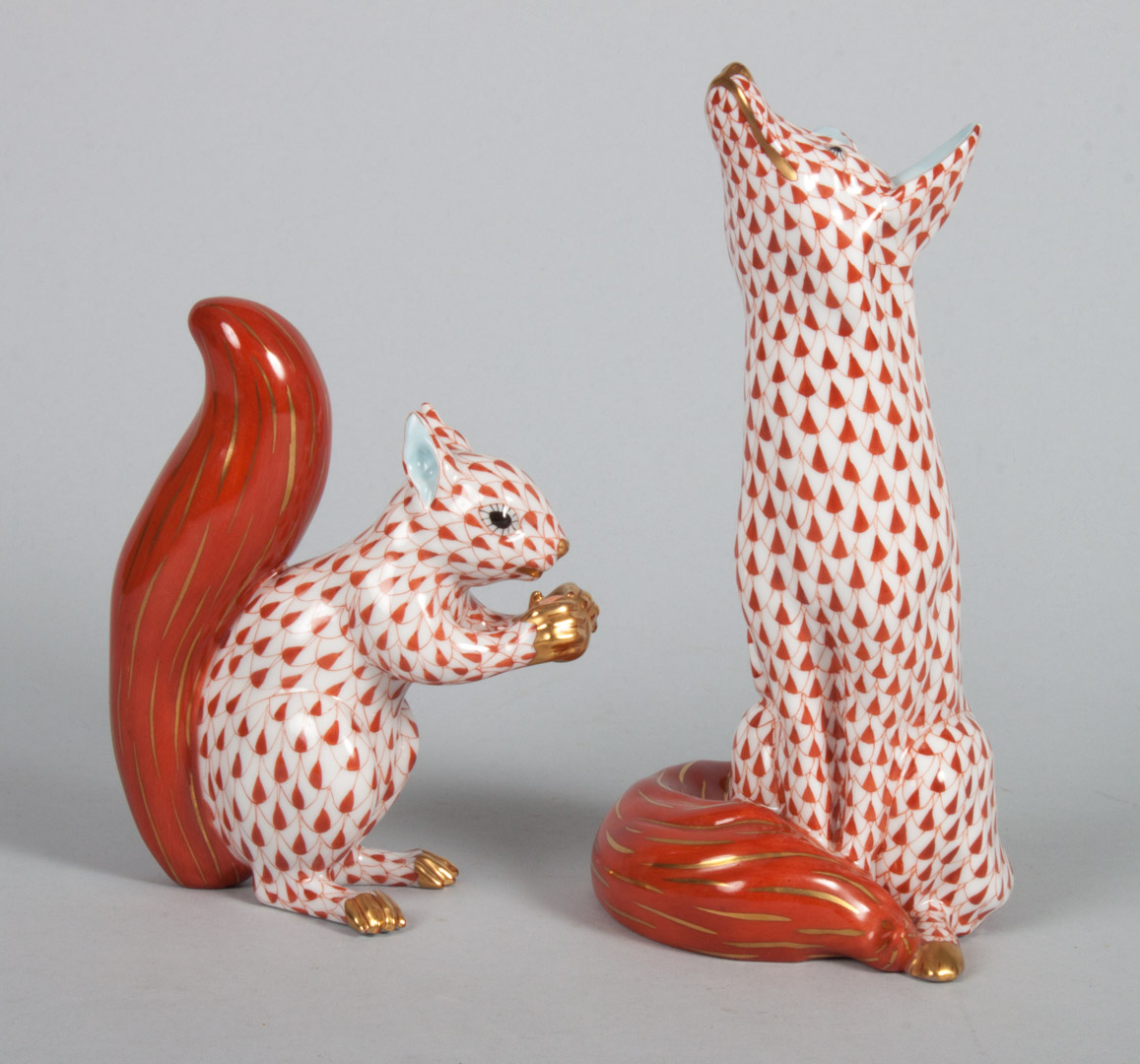 Appraisal: Herend porcelain fox and a squirrel in the Rust Fishnet