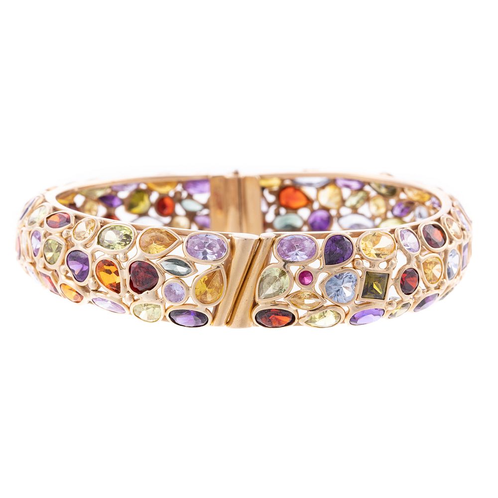 Appraisal: A Multi-Gemstone Hinged Bangle in K K yellow gold hinged