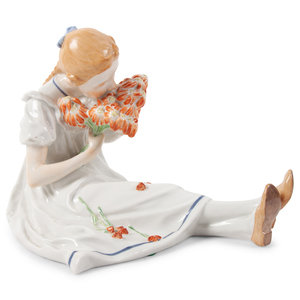 Appraisal: A Meissen Porcelain Figure of a Seated Girl with Flowers