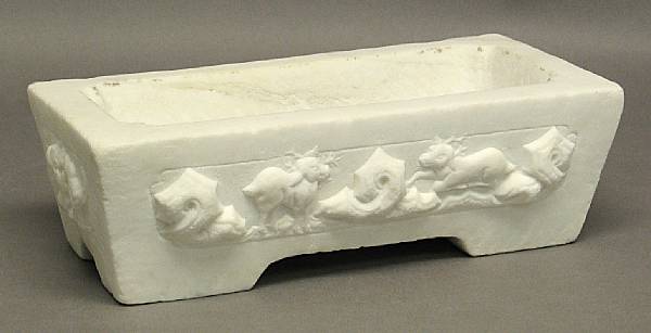 Appraisal: A small carved marble basin Of rectangular form its canted