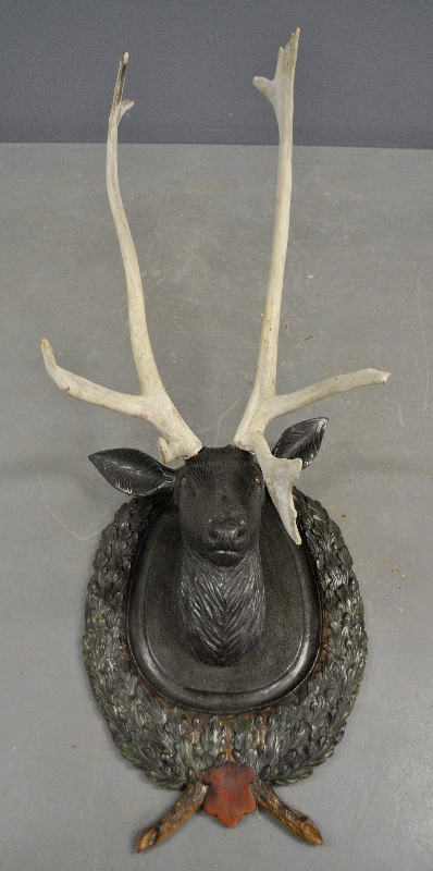 Appraisal: - Life-size Black Forest stag head with glass eyes surrounded