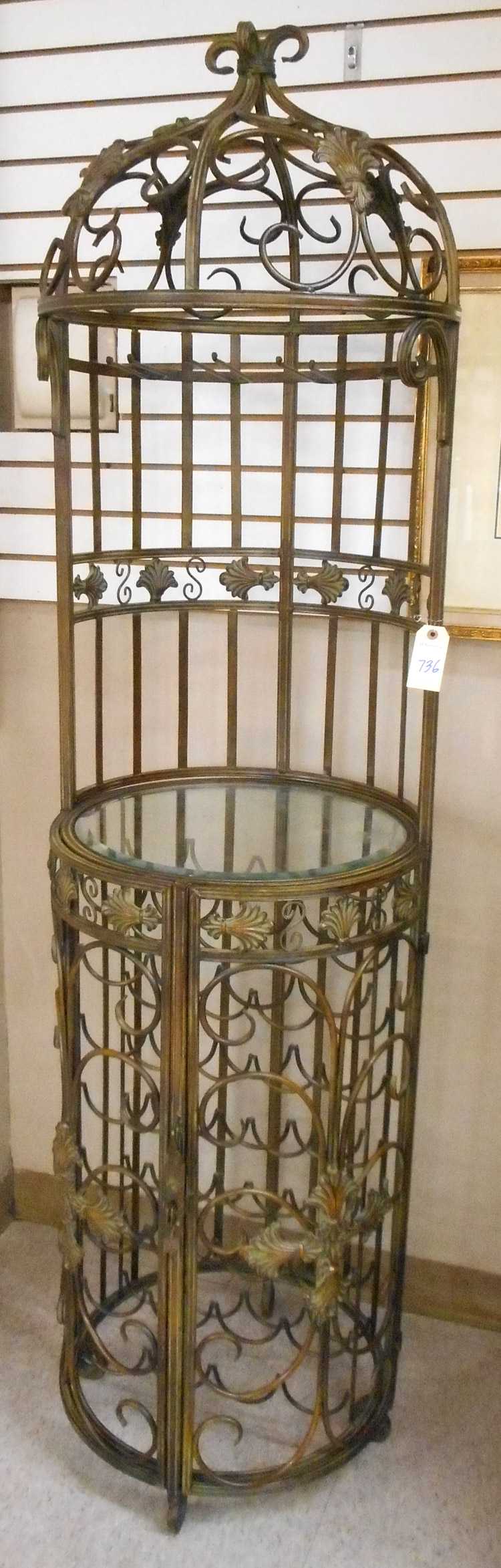 Appraisal: BRONZED WROUGHT IRON WINE SERVING STAND AND CELLAR The cylindrical