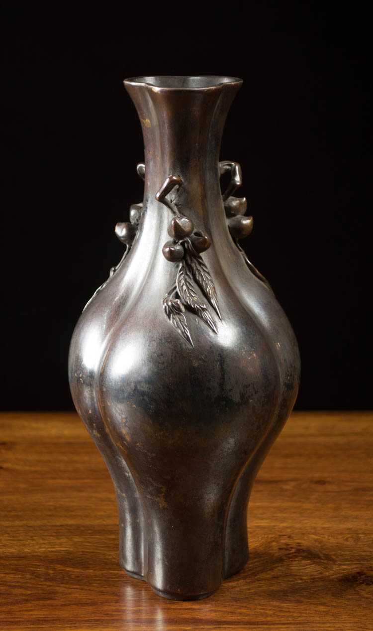 Appraisal: CHINESE BRONZE VASE lobed form with three branch handles with