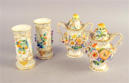 Appraisal: Four English floral encrusted porcelain table items Comprising a pair